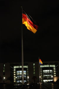 Low angle view of illuminated city at night