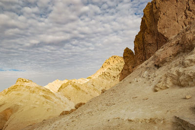 Rock formations on land against sky