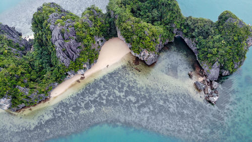 High angle view of rocks by sea