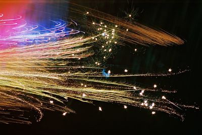 Close-up of fireworks against sky at night