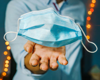 Close-up of man holding hands