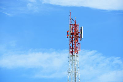 Low angle view of communications tower against sky