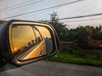 Reflection of road on side-view mirror