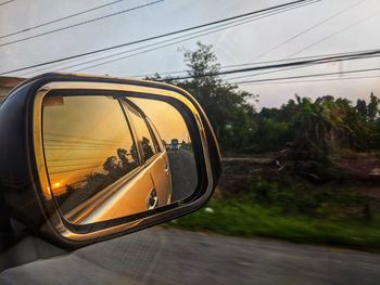 Reflection of road on side-view mirror