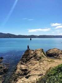 Scenic view of sea against blue sky