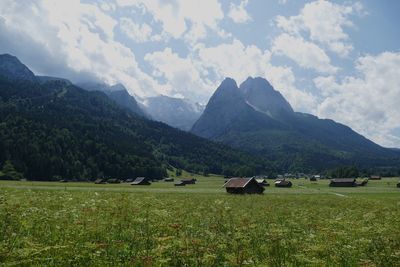 Scenic view of landscape and mountains against sky