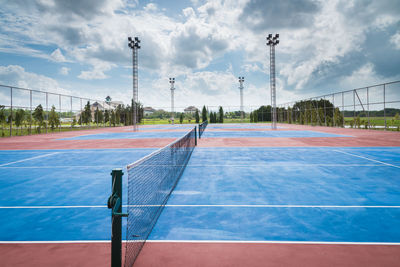 Empty tennis court against sky