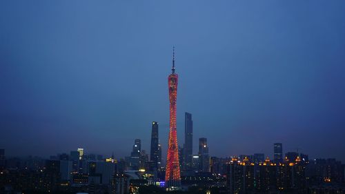 Low angle view of illuminated building against blue sky