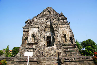 Low angle view of kalasan temple against clear blue sky