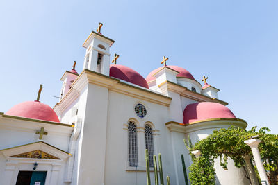 Low angle view of traditional building against clear blue sky