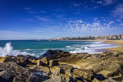 View of beach against cloudy sky