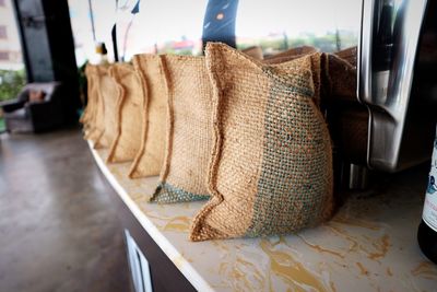 Close-up of sacks on table