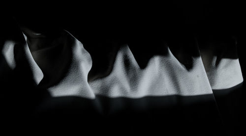 Close-up of shadow on bed