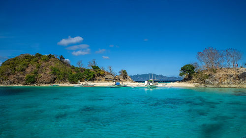 Scenic view of sea against blue sky