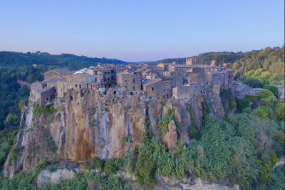 Panoramic view of trees and buildings against sky