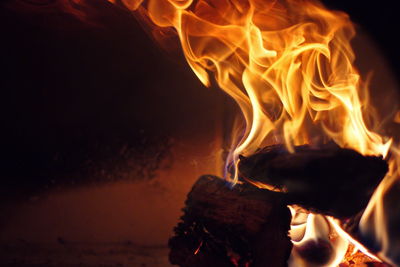 Close-up of fire burning at night