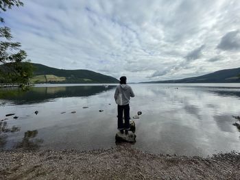 Rear view of woman walking on beach