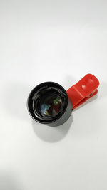 High angle view of camera on white background
