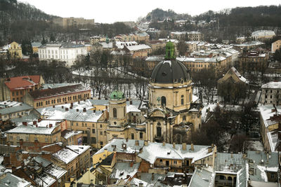 High angle view of houses in city during winter