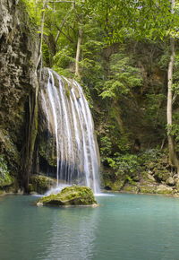 Scenic view of erawan waterfall in forest