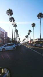 Cars on road against sky