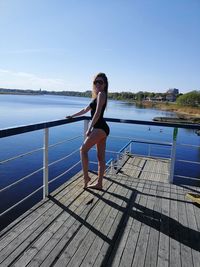 Full length of woman in sea against sky