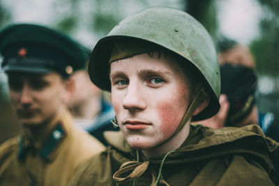 Portrait of handsome young man in park