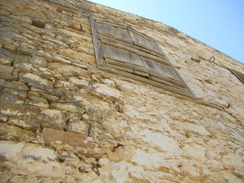 Low angle view of brick wall