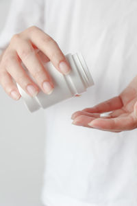 Cropped hand of woman with nail polish