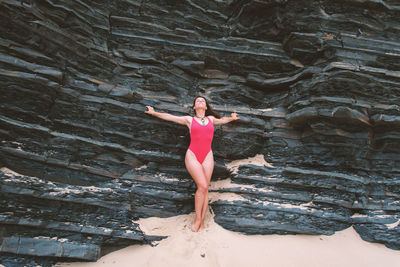 Woman in bikini standing on beach