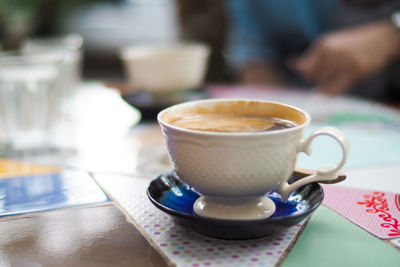 Close-up of coffee cup on table