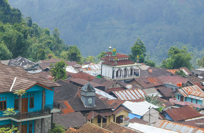 Tolerance between muslims and christians, showing a mosque and church building and harmoniously.