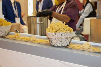 Midsection of man preparing food on table