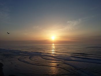 Scenic view of sunset over sea