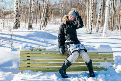 Full length of woman on snow field