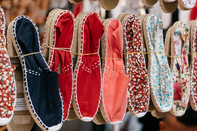 Close-up of footwear hanging on display at store