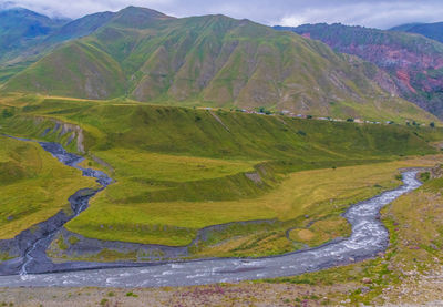 Scenic view of landscape and mountains against sky