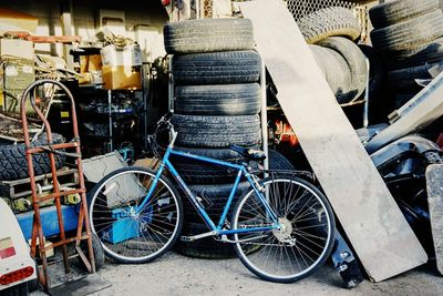 Bicycle parked against brick wall