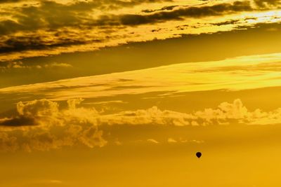 Low angle view of hot air balloon against sky during sunset