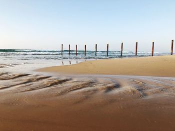 View of beach against clear sky