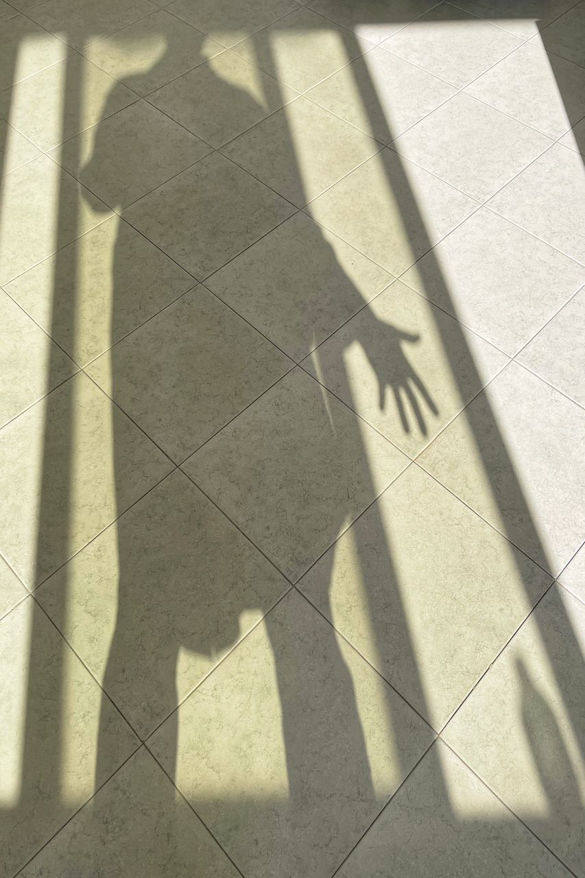 SHADOW OF PEOPLE ON FLOOR