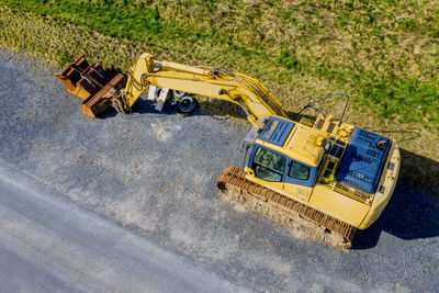 Aerial view of yellow and cars on road