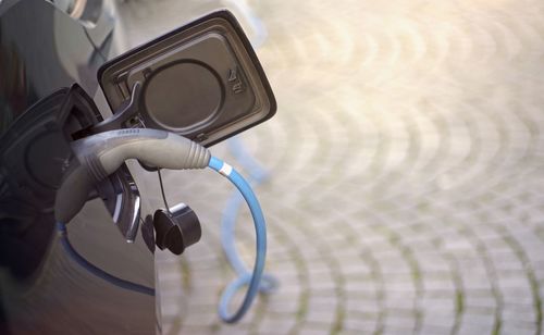 Close-up of car with electric charger