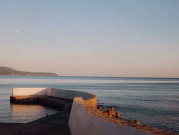 Scenic view of sea against clear sky during sunset