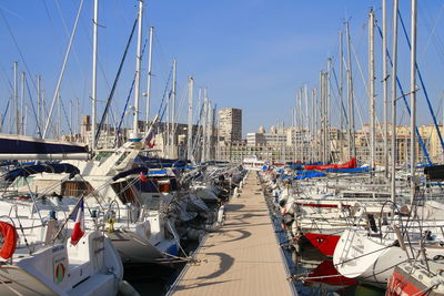 Boats moored at harbor