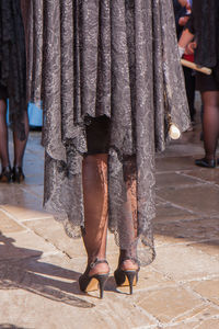 Low section of woman standing on floor