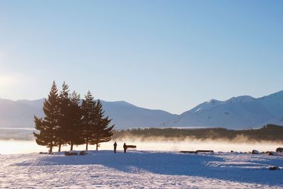 Scenic view of snowcapped mountains against clear sky