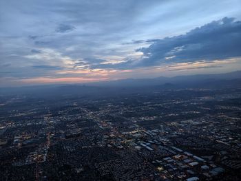 High angle view of city against sky during sunset