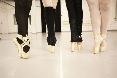 Low section of people standing on floor