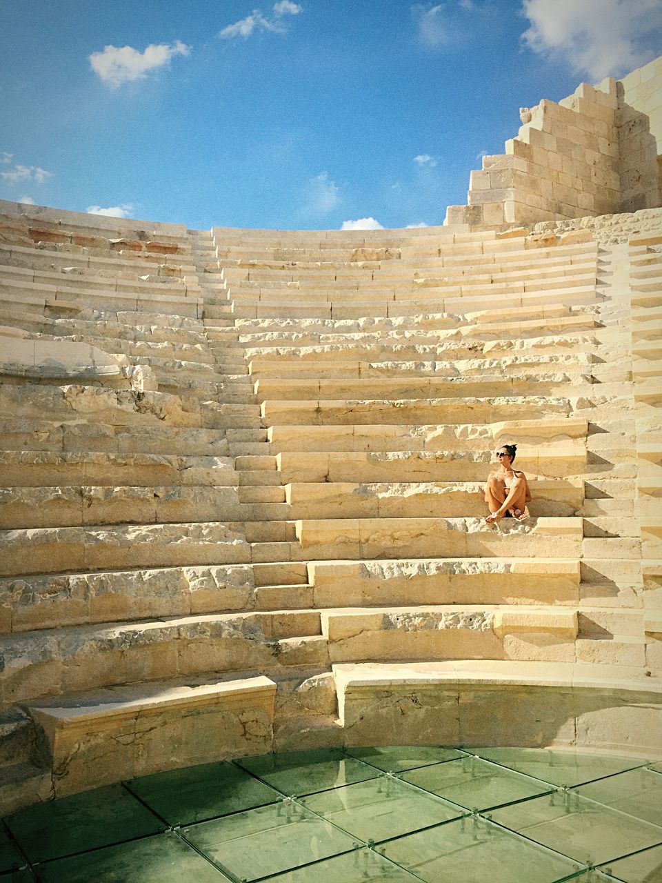 steps, sunlight, sky, built structure, architecture, low angle view, day, the past, outdoors, ancient civilization, blue, weathered, history, solitude, tourism, remote